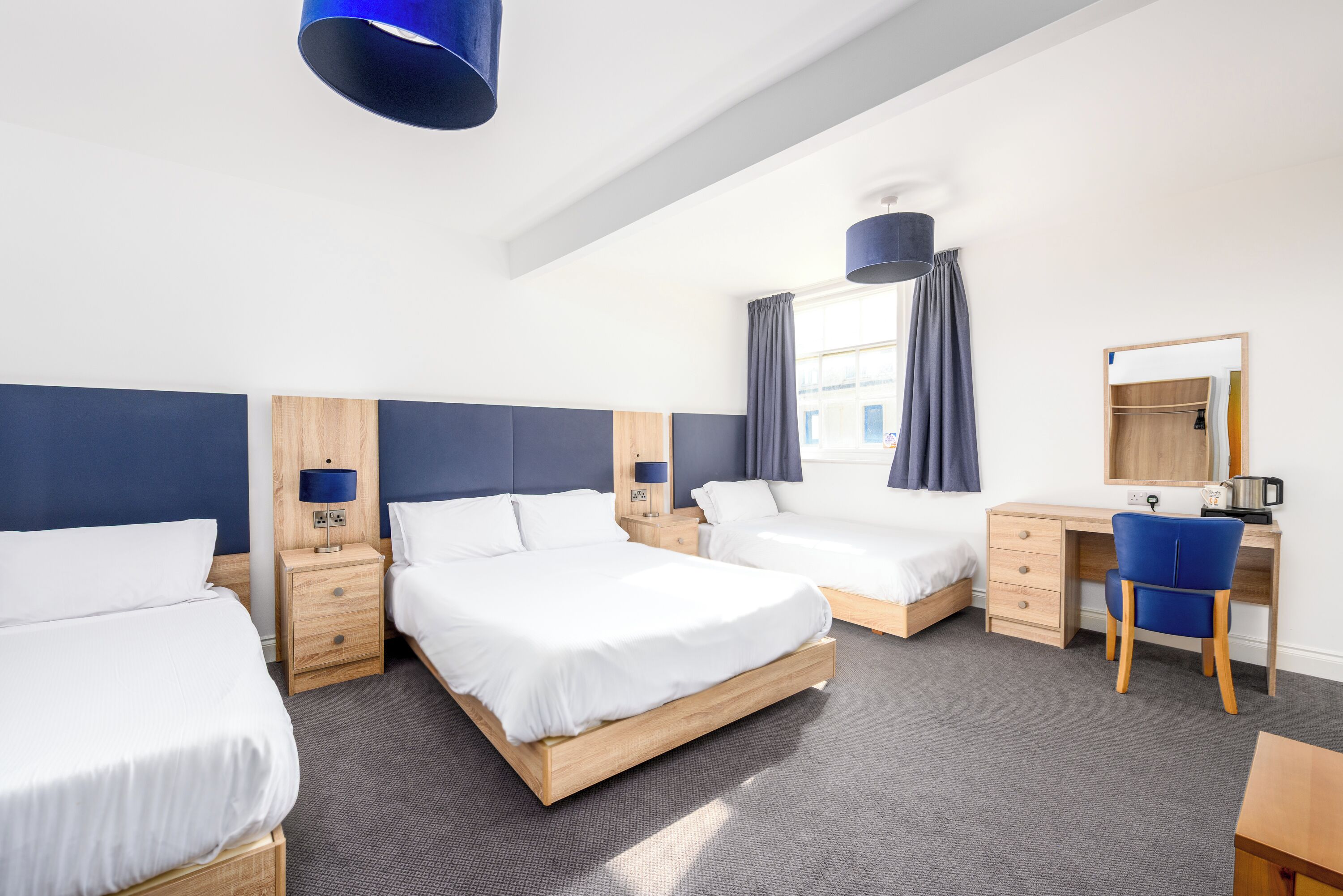 Premium Quadruple Room | Desk, laptop workspace, iron/ironing board, bed sheets