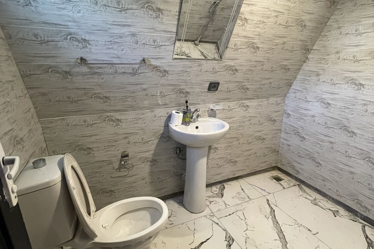 Shower, rainfall showerhead, hair dryer, towels