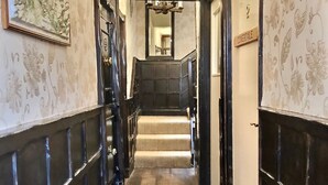 A hallway with a staircase leading to a room labeled "COVERDALE". - Grove House (Leyburn)