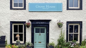 A traditional house named Grove House with a sign indicating its establishment around 1757. - Grove House (Leyburn)