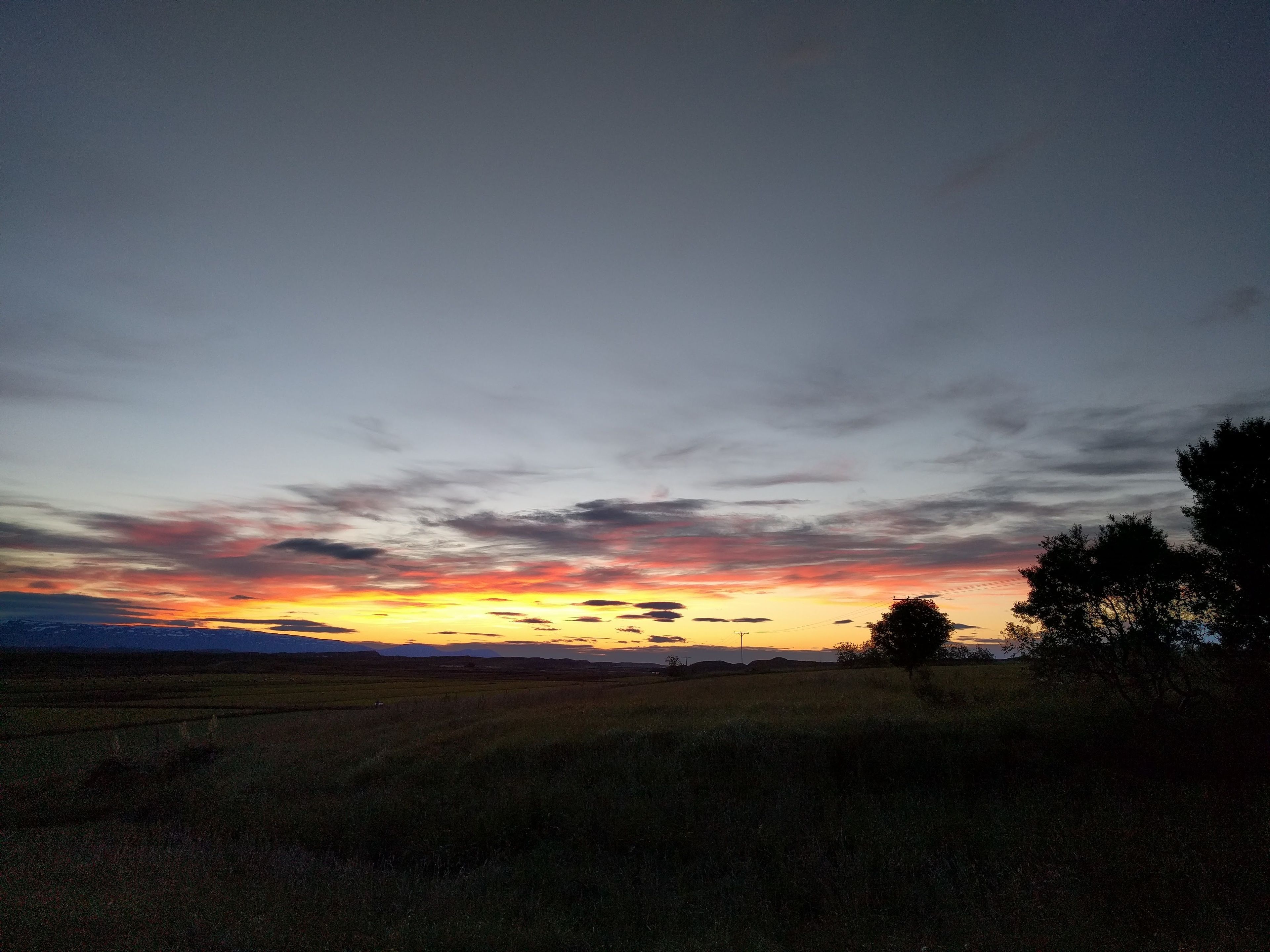 A flat landscape with a sunset.