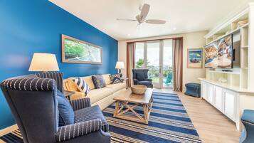 King Pool View Suite | Living area | 54-inch flat-screen TV with cable channels, TV