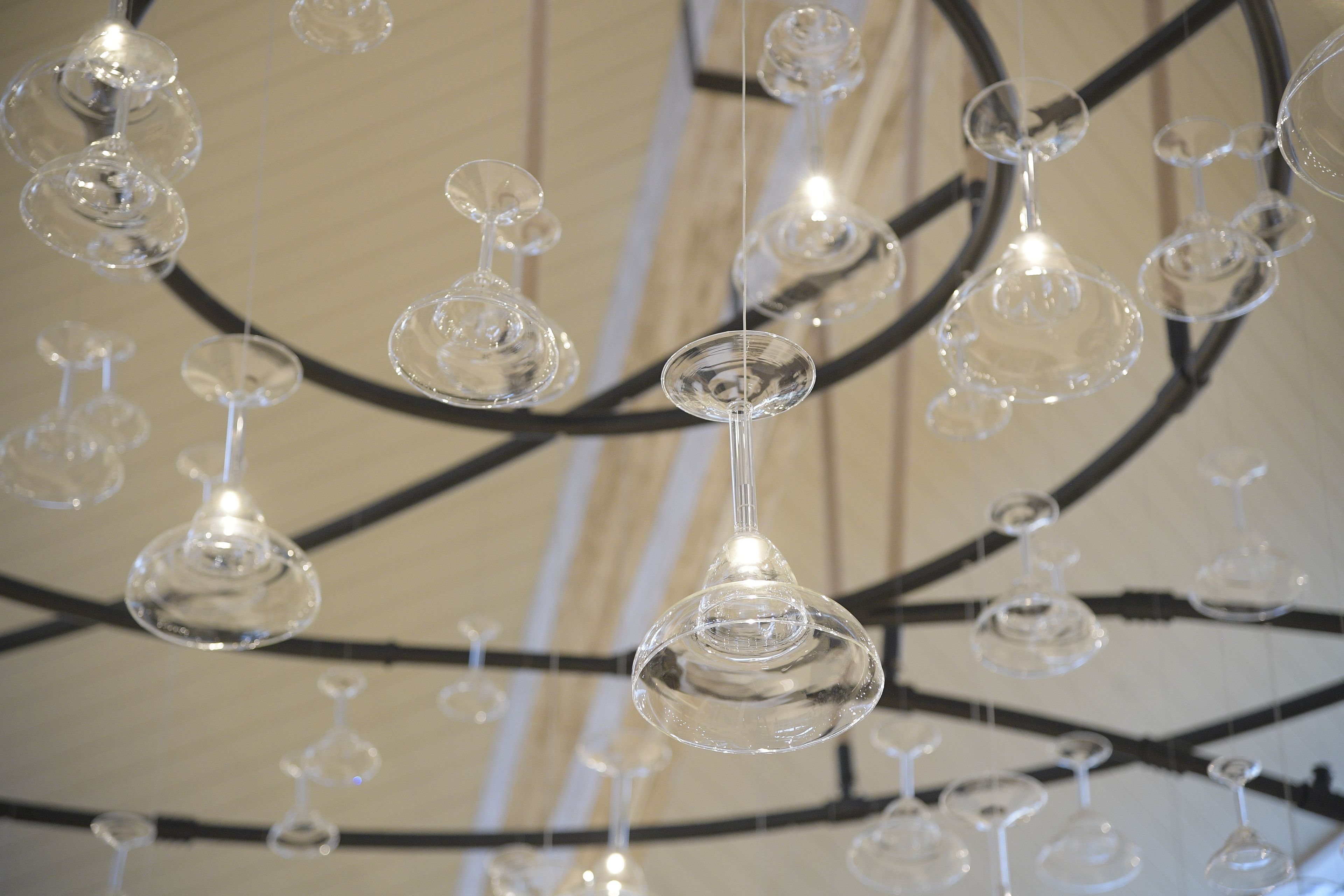 A ceiling with multiple hanging glass light fixtures.