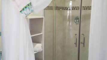 Basic Apartment, 1 Queen Bed, Garden View | Bathroom | Shower, free toiletries, hair dryer, towels