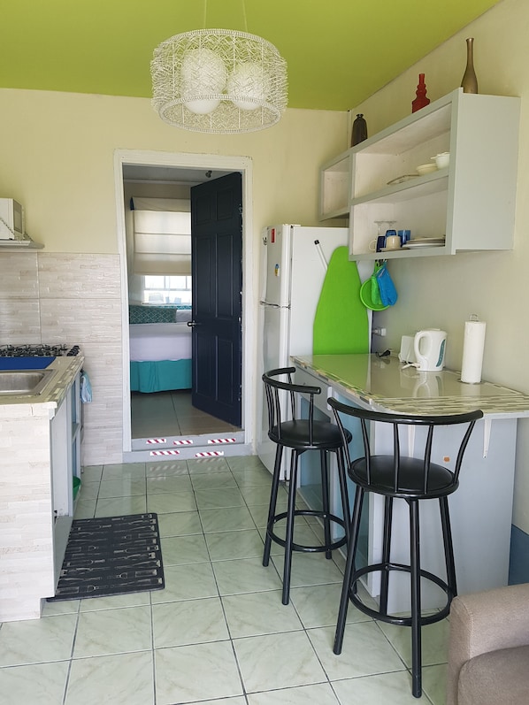 Basic Apartment, 1 Queen Bed, Garden View | 1 bedroom, iron/ironing board, free WiFi, bed sheets