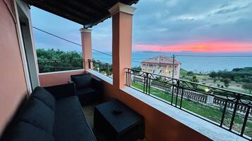 Romantic Double or Twin Room with Seaview | Living area | Flat-screen TV