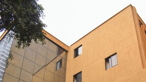 A building with a modern facade, multiple windows, and a visible entrance. - Joy Palace (Nairobi)