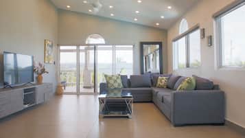 Standard Apartment, 2 Bedrooms, Garden View | Living area | 50-inch Smart TV with cable channels, TV