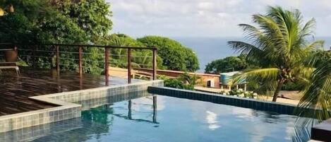 Outdoor pool, open 9:00 AM to 7:00 PM, sun loungers