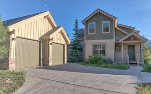 A two-story house with a garage, a front porch, and a driveway. - 120 Rachel Lane Private Home with Hot Tub (Breckenridge)