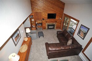 Deluxe Condo, 2 Bedrooms, Balcony, Mountain View | Living area | Fireplace