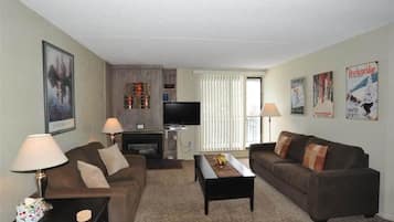 Elite Apartment, Balcony, Mountain View | Living area | Fireplace