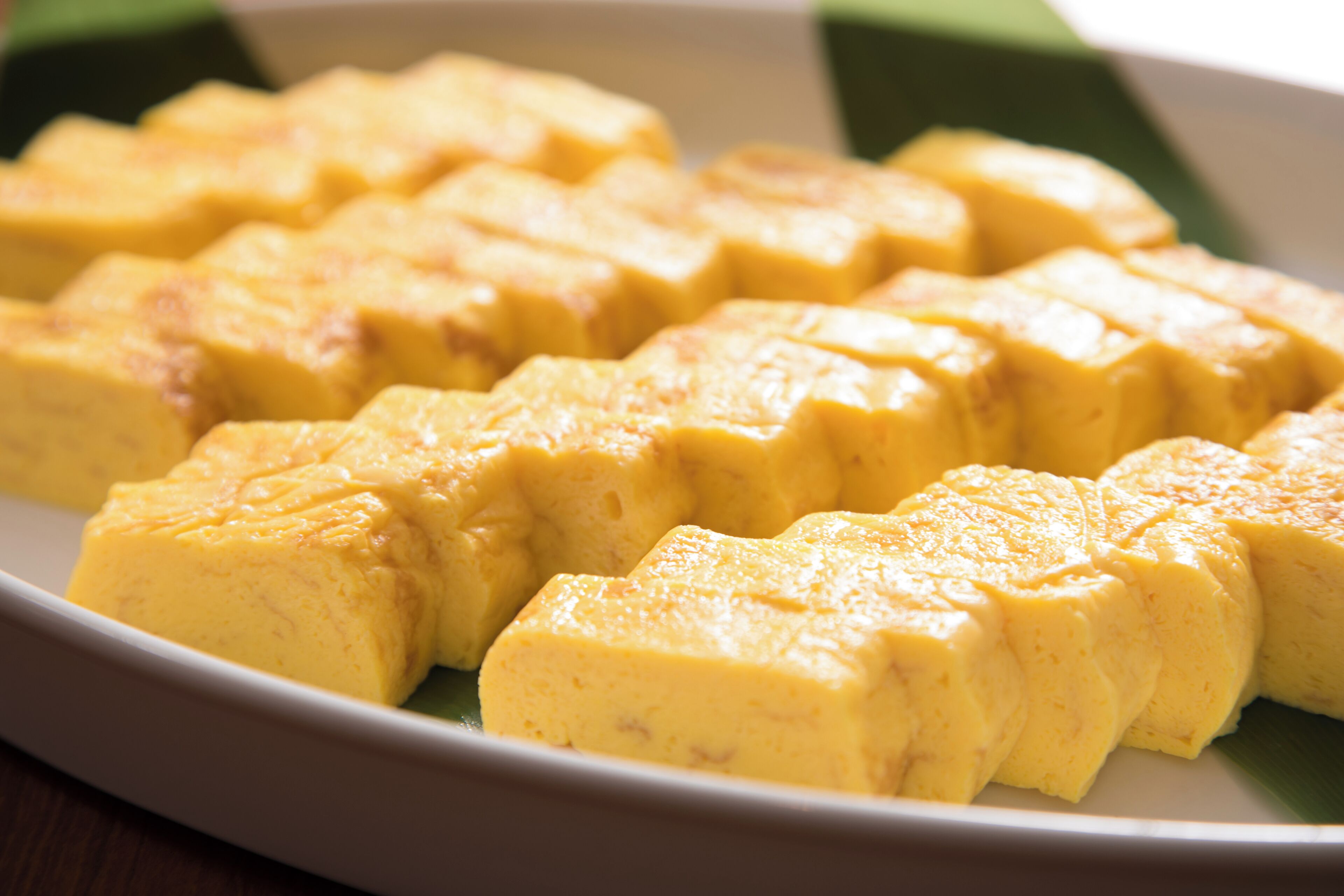 A plate of yellow custard cubes.