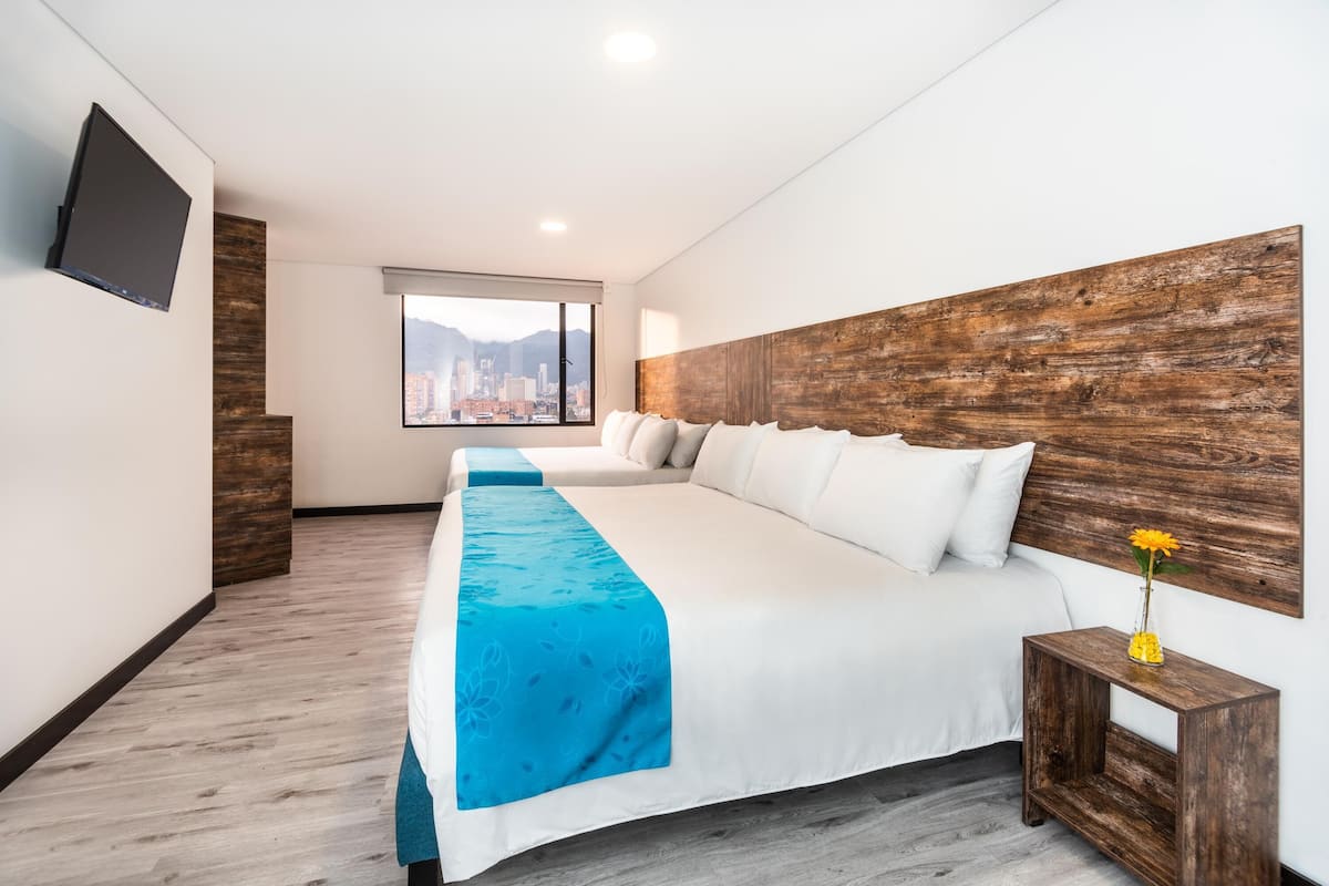 Quadruple Room | Minibar, in-room safe, desk, soundproofing