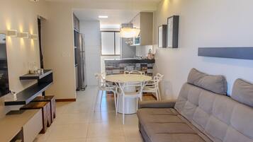 Luxury Apartment | Living area | 50-inch flat-screen TV with satellite channels, TV