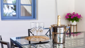 A table with a champagne bottle and glasses on a tray, a silver pitcher, and a window with blue shutters. - CHARMING VILLA NEAR THE SEA, SEA VIEWS. CLIMATIZED POOL. AC AND WIFI FREE (Callao Salvaje)