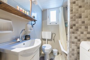 Bathtub, hair dryer, soap, shampoo