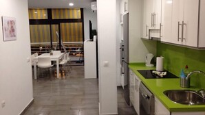 A modern kitchen with white cabinets, a green countertop, and a stainless steel sink. - Fantastic apartment with A / C in las Vistas Beach, Los Cristianos (Los Cristianos)