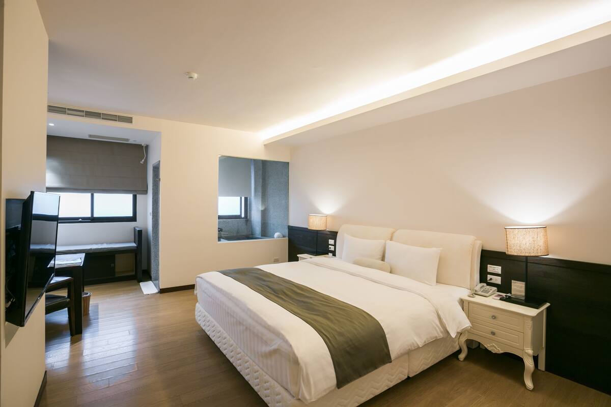 Standard Double Room | Minibar, in-room safe, desk, blackout drapes