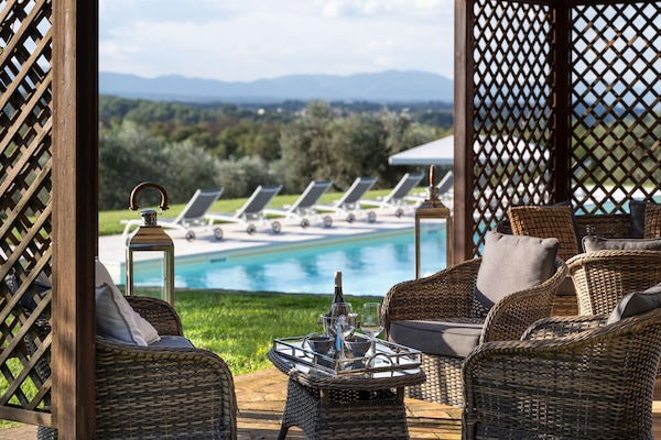 Seasonal outdoor pool, open 8 AM to 8 PM, pool loungers