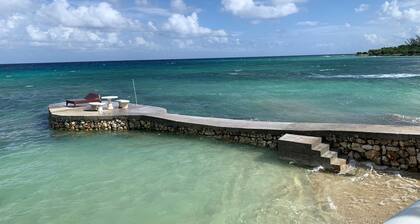 House by the sea with a small sandy beach, pool and fantastic views