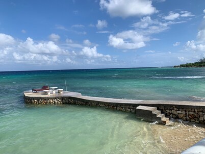 House by the sea with a small sandy beach, pool and fantastic views