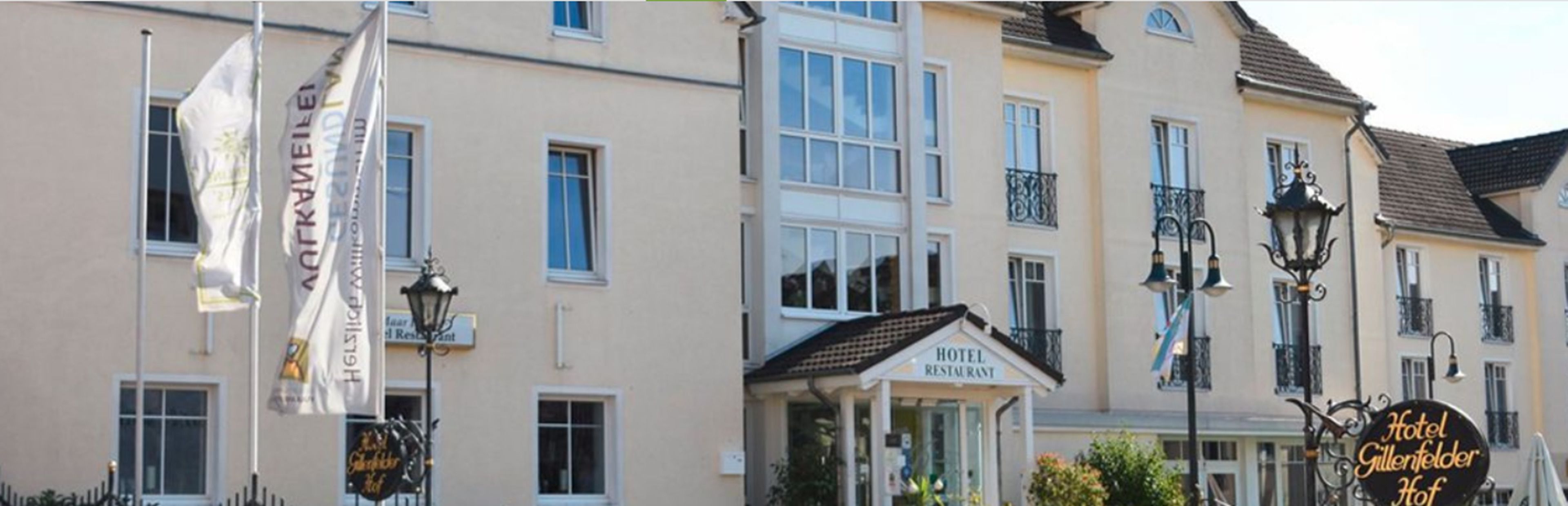 A hotel with a sign indicating it is a hotel and restaurant.