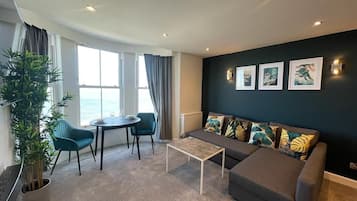 Deluxe Apartment, 1 Bedroom, Non Smoking, Sea View (Second Floor) | Living area | 40-inch LCD TV with digital channels, fireplace, Netflix
