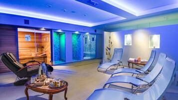 Relax in a serene space with a seating area, massage table, and refreshments.