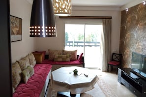 Luxury Apartment, 2 Bedrooms | Living area | 50-inch flat-screen TV with satellite channels, TV
