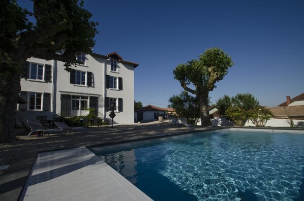 Seasonal outdoor pool, pool umbrellas, pool loungers