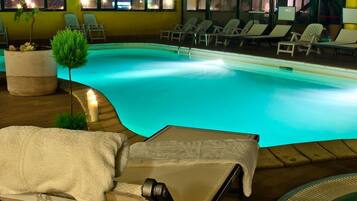 Indoor pool, open 8:30 AM to midnight, pool loungers