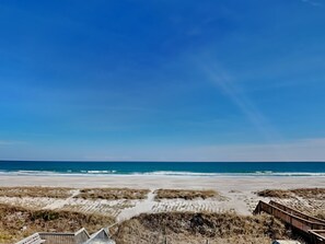 Enjoy a serene beachside retreat with access to the sandy beach and scenic coastal views.