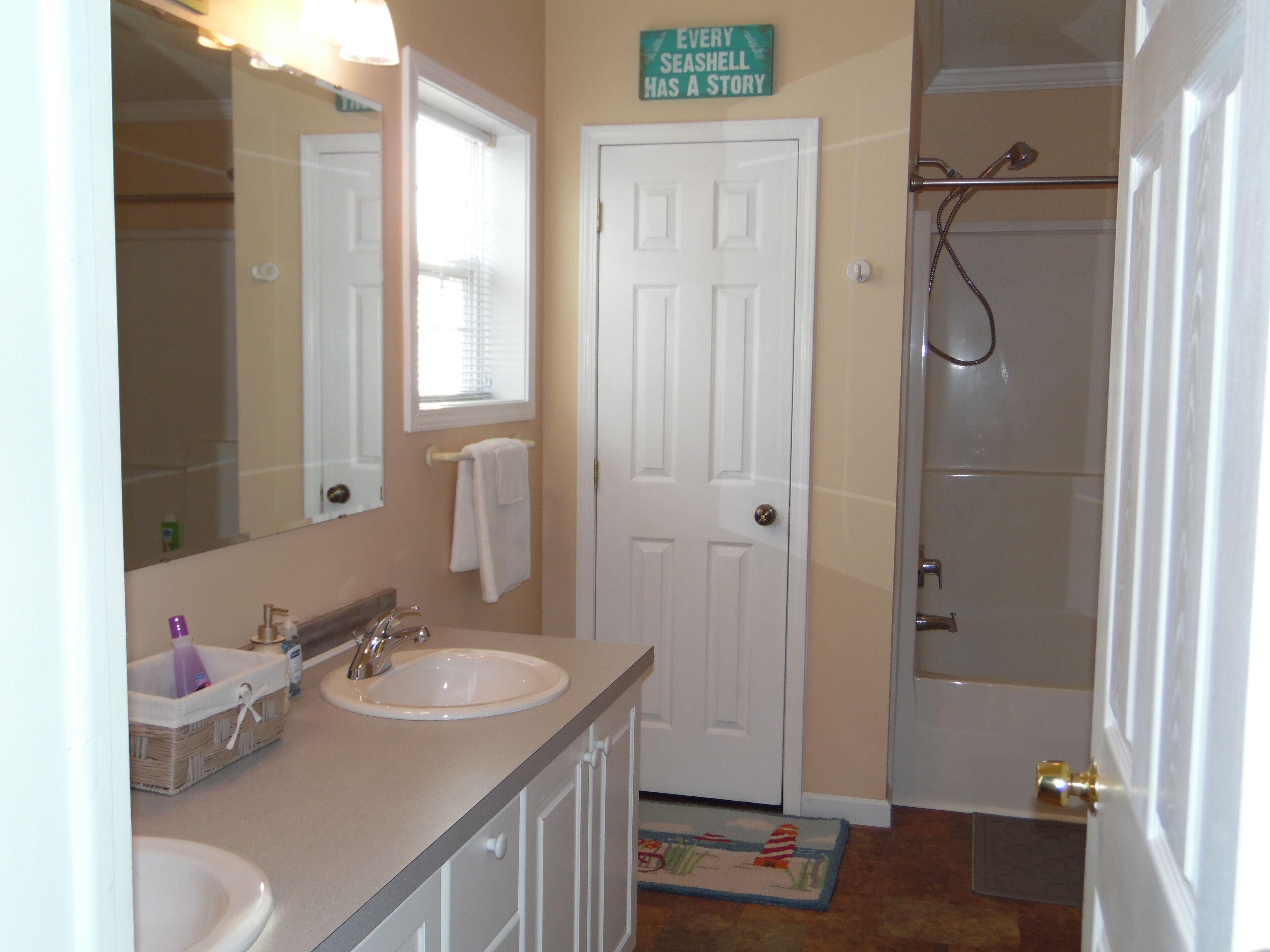 Bathtub, hair dryer, towels, soap
