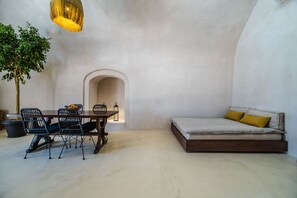 Prestige Suite with Indoor Hot Tub & Outdoor Pool | Living area - Phaos 1870 A Restored Winery (Santorini)