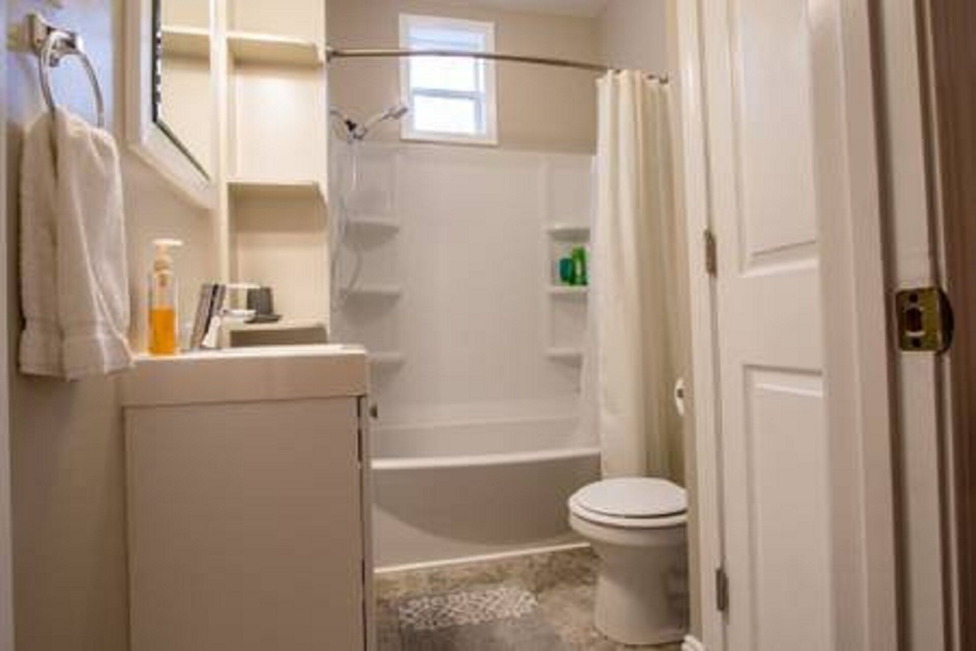 Combined shower/bathtub, hair dryer, towels, soap