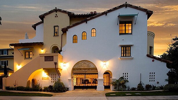 A large, white, two-story building with multiple windows and a central archway. - Experience West Beach living, just steps away from Santa Barbara Harbor (Santa Barbara)