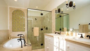 A bathroom with a glass-enclosed shower, a bathtub, and a vanity with a large mirror. - Experience West Beach living, just steps away from Santa Barbara Harbor (Santa Barbara)