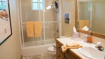 Bathtub, hair dryer, towels, soap
