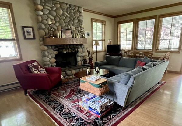 TV, fireplace, books