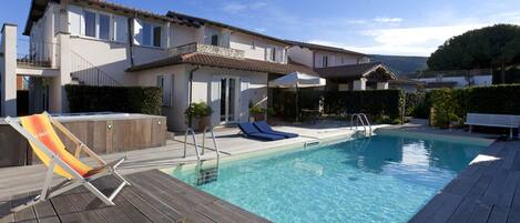 Seasonal outdoor pool, pool loungers