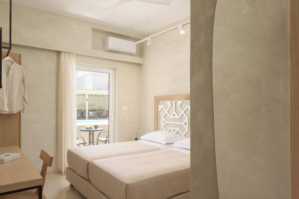 deluxe double room, non smoking, pool view | in-room safe, blackout curtains, free wifi, bed sheets