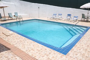 Outdoor pool, open 6 AM to 10 PM, pool umbrellas, sun loungers