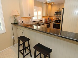 Fridge, microwave, oven, stovetop - Bayside 2BR on Whitney Beach w Canal Views, Pool, and Private Lanai  by RVA (Longboat Key)