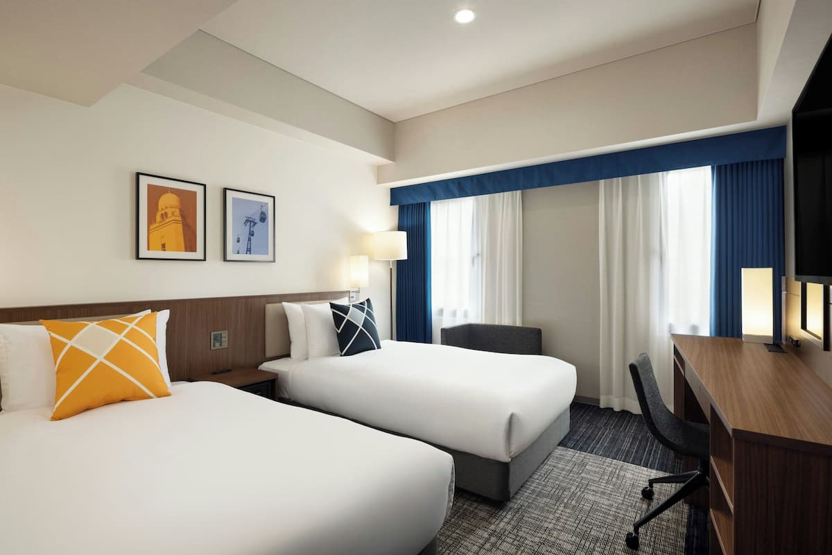 room, 2 single beds | 1 bedroom, in-room safe, desk, laptop workspace