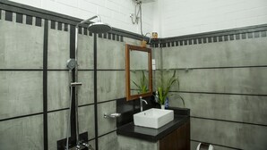 A bathroom with a shower, sink, and mirror. - Brown House (Unawatuna)