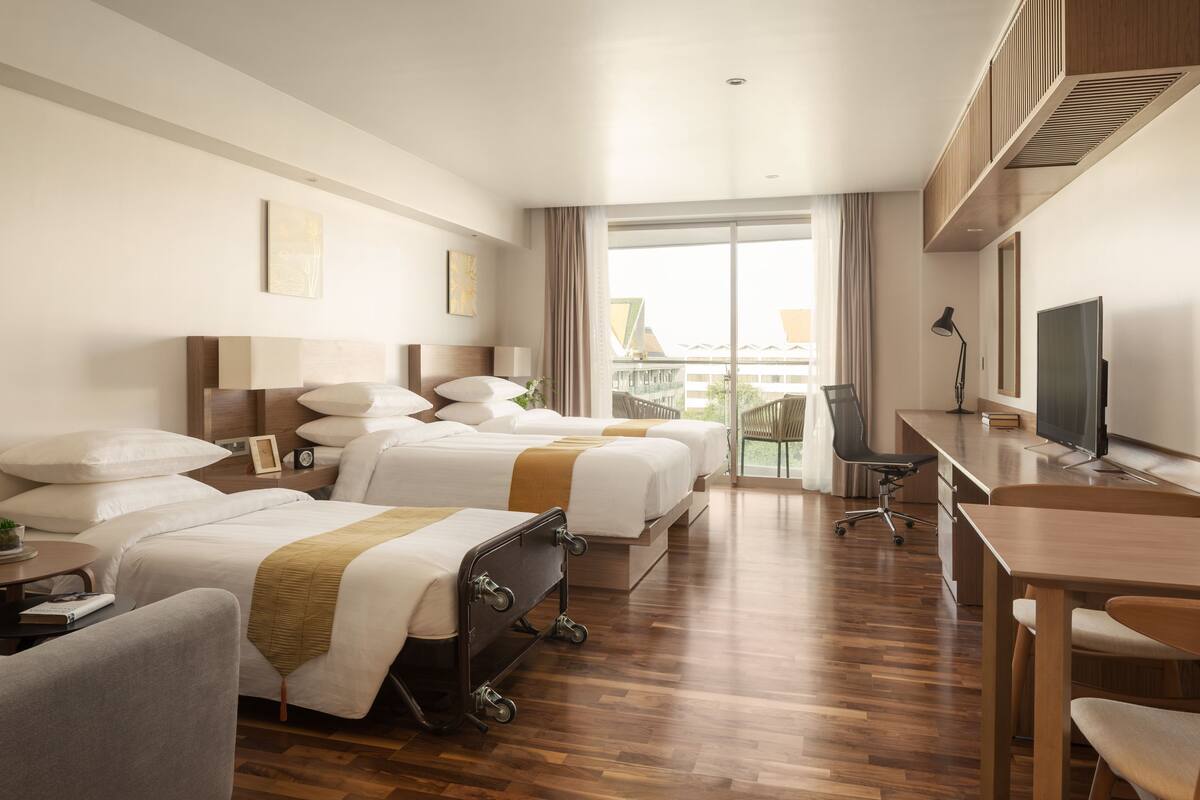 Standard Triple Room | In-room safe, desk, laptop workspace, blackout curtains