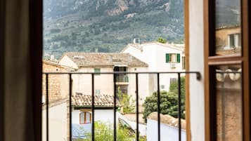 Junior Suite, Mountain View | Free minibar items, in-room safe, desk, iron/ironing board