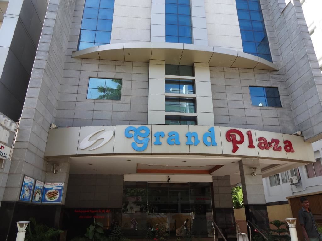 The exterior of Grand Plaza hotel with a modern design, featuring a prominent entrance and signage.