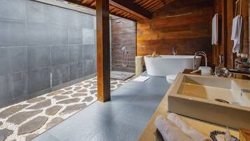 Separate tub and shower, deep soaking tub, free toiletries, bathrobes